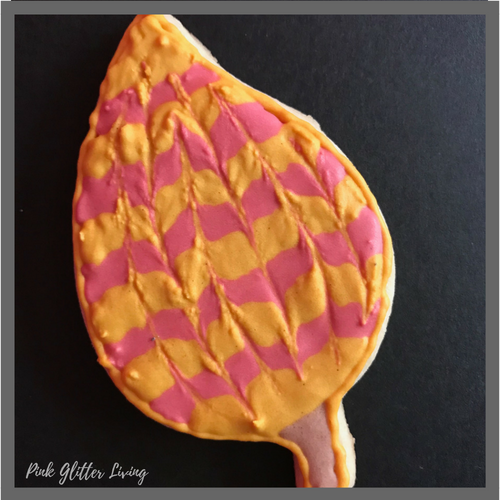 leaf sugar cookie with swirled royal icing